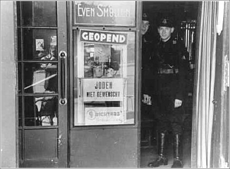 Dutch Nazi party stand in the doorway of a restaurant